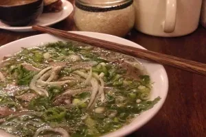 Pho Bo in a bowl with chopsticks