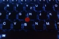 Picture of the middle of a backlit ThinkPad keyboard