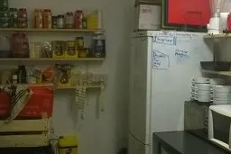 Photograph from a back room of a kitchen